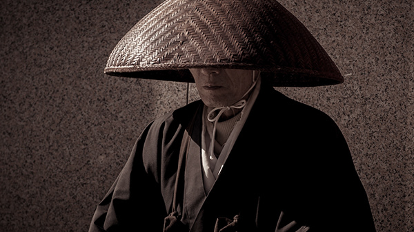 Buddhist monks collecting alms on the street. Himeji, Japan